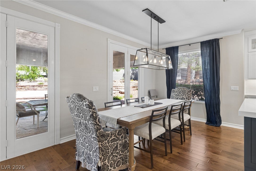 9916 Aspen Knoll Court, Las Vegas, NV 89117 Polished floors and classic crown molding elevate this welcoming dining space off kitchen .