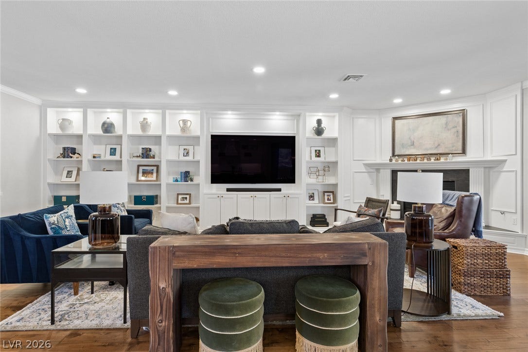 9916 Aspen Knoll Court, Las Vegas, NV 89117 Custom built-ins and classic fireplace in this warm living space.
