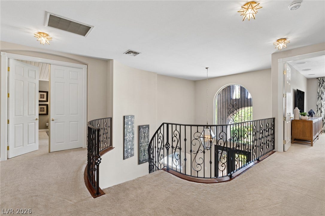 9916 Aspen Knoll Court, Las Vegas, NV 89117 Top of stairwell Primary bedroom at left and Loft area at right.