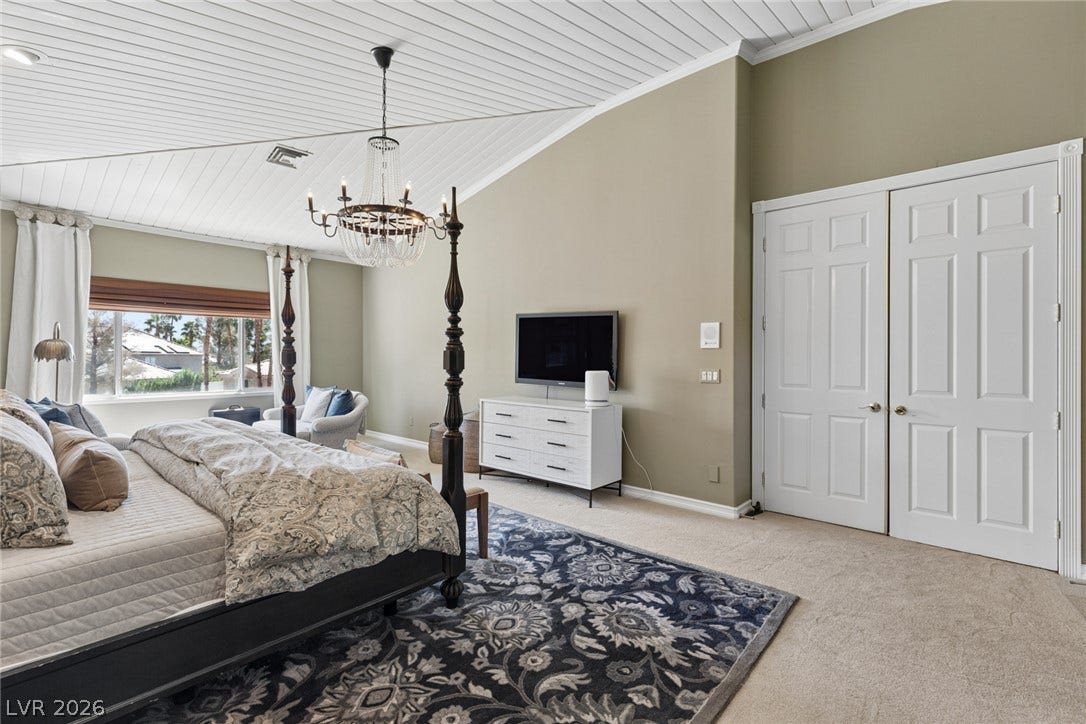 9916 Aspen Knoll Court, Las Vegas, NV 89117 Vaulted wood-paneled ceilings and plush carpeting define this serene master bedroom retreat. Gorgeous chandelier