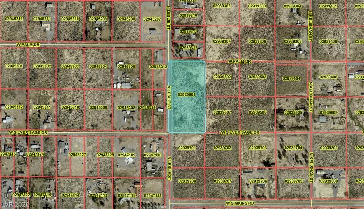 4221 N Leslie Street, Pahrump, NV 89060 An aerial plat map outlines the parcel boundaries of this desert lot.