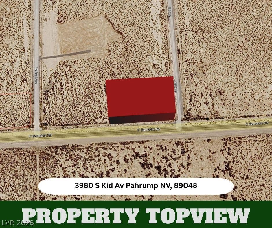 An aerial perspective captures the parcel footprint situated within a desert landscape.