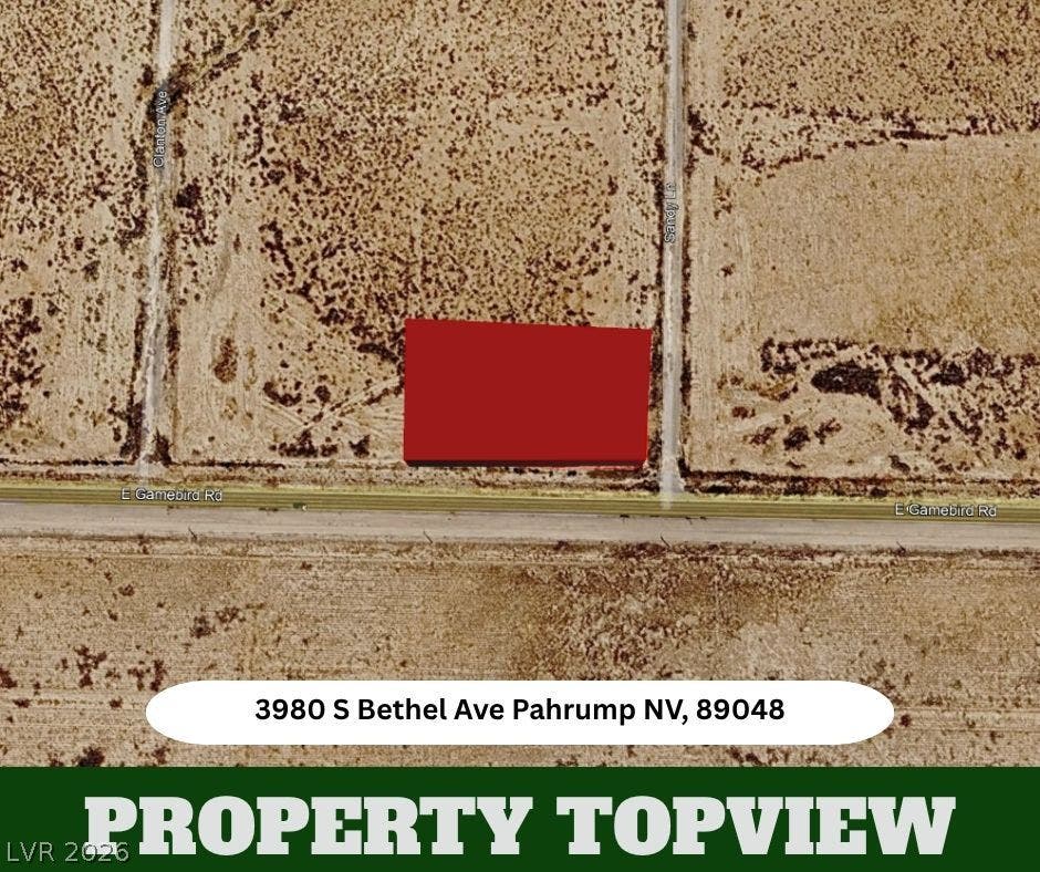 An aerial layout highlights the boundaries of this desert parcel along E Gamebird Road.