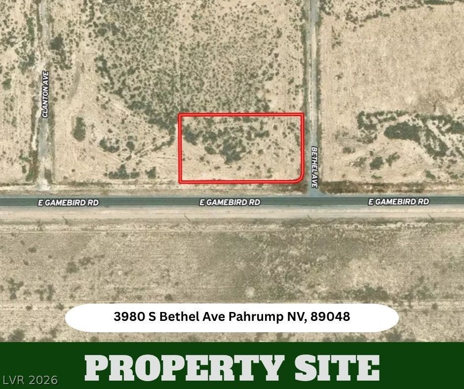 An aerial plat map outlines this desert parcel situated along established roadways.