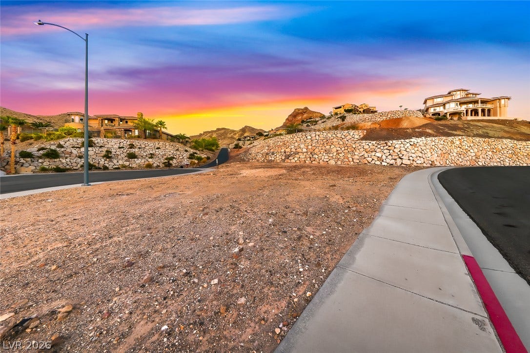 1157 Big Bird Court, Henderson, NV 89011 Scenic mountain vistas frame this prime building lot with established paved roads and sidewalks.