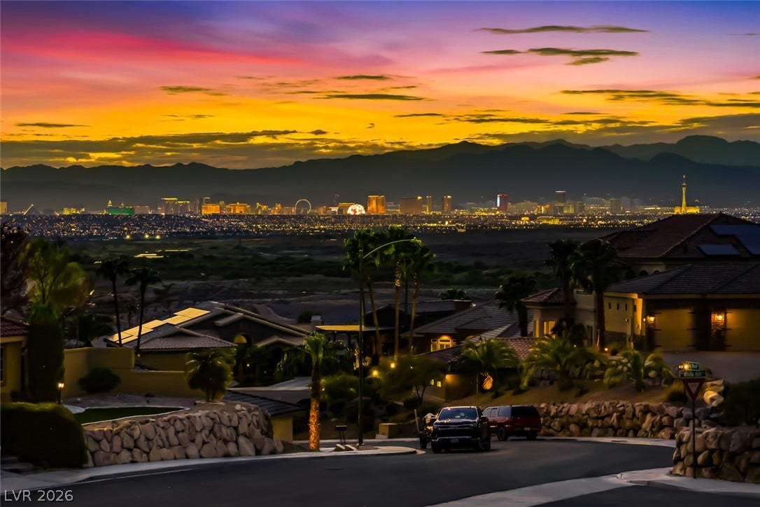 1157 Big Bird Court, Henderson, NV 89011 Distant mountains and a sparkling skyline frame this spectacular evening panorama.