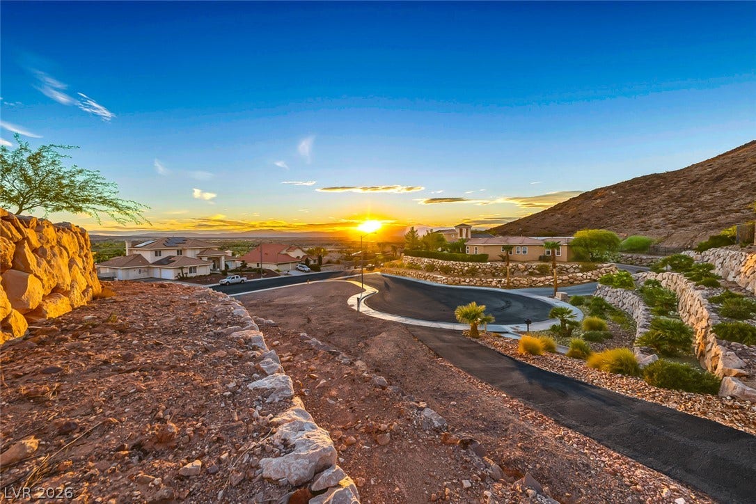1157 Big Bird Court, Henderson, NV 89011 Gravel paths and stone retaining walls line the hillside overlooking the quiet neighborhood below.
