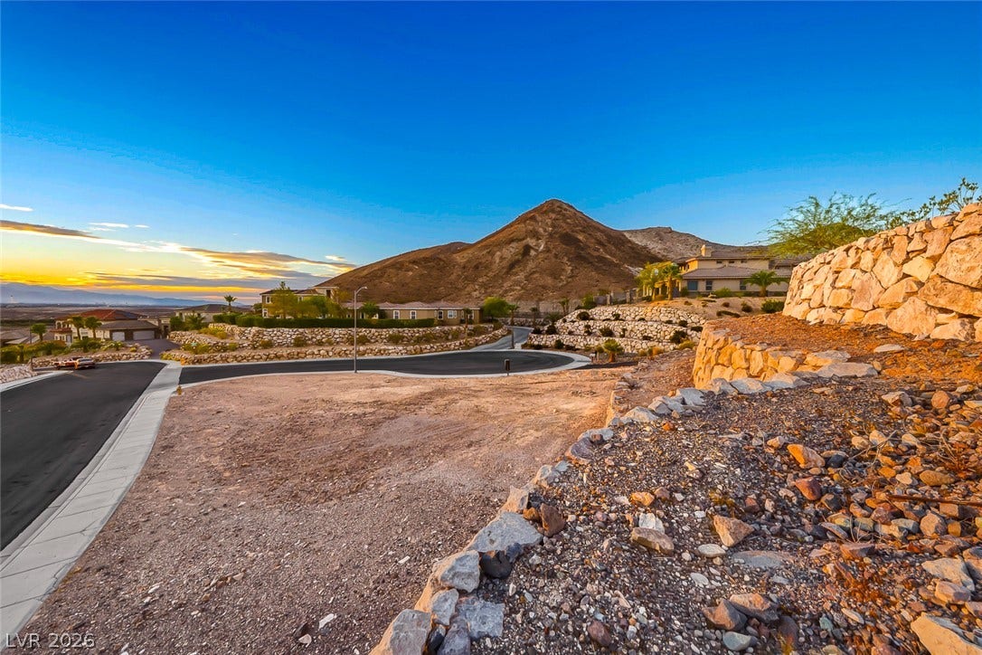 1157 Big Bird Court, Henderson, NV 89011 Dramatic mountain vistas frame this elevated lot, offering a perfect setting for a custom home.