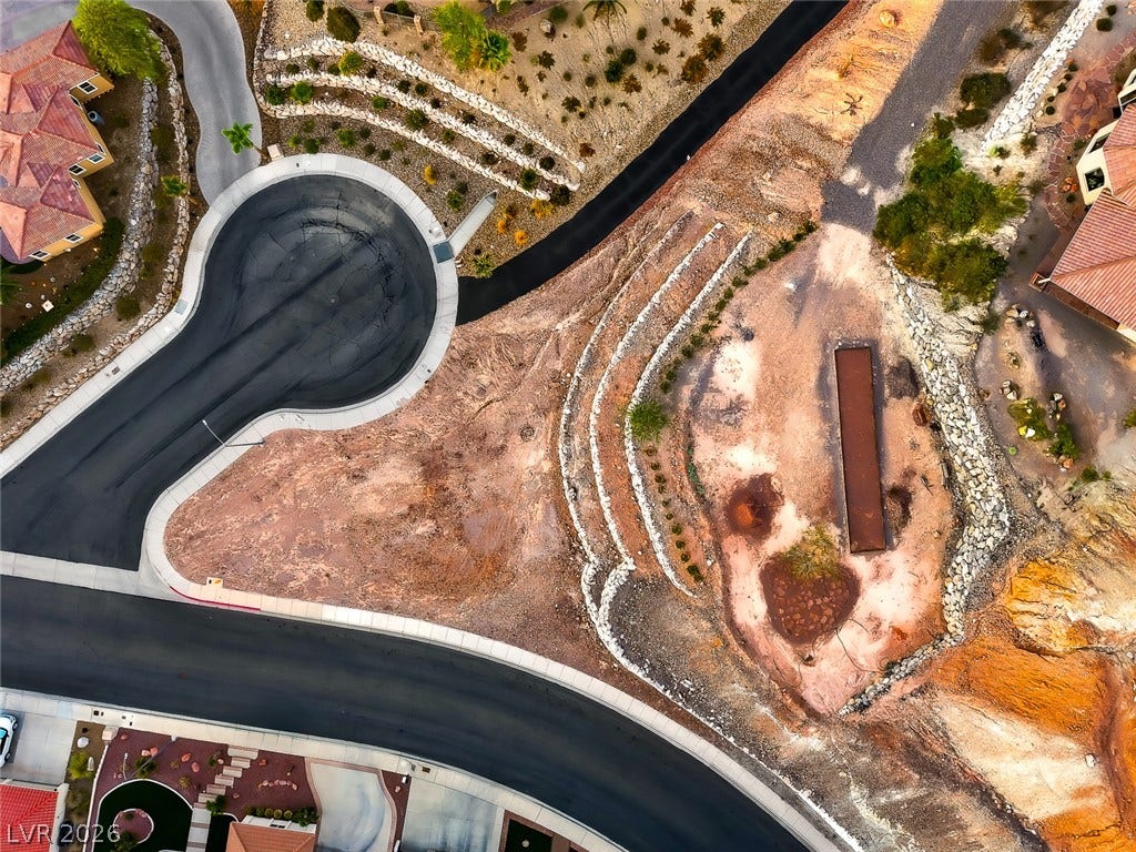1157 Big Bird Court, Henderson, NV 89011 An aerial perspective showcases the terraced landscape design bordering the quiet cul-de-sac.