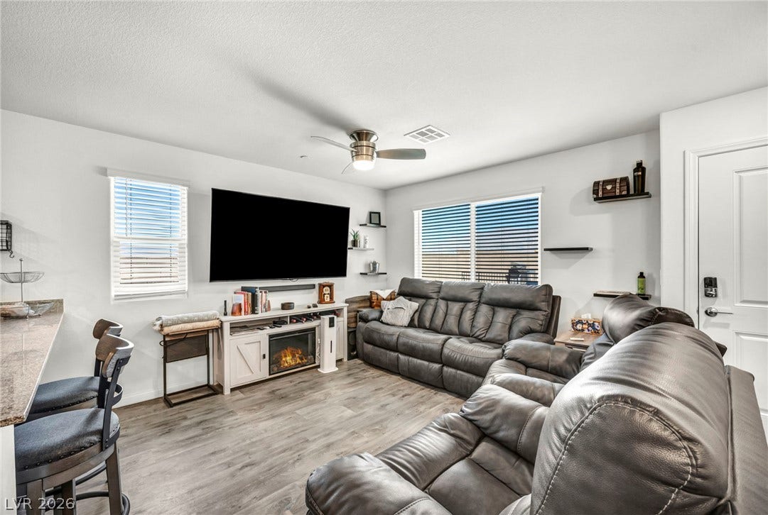 2594 Canary Yellow Court, North Las Vegas, NV 89086 Clean lines and durable wood-look flooring define this welcoming gathering area.