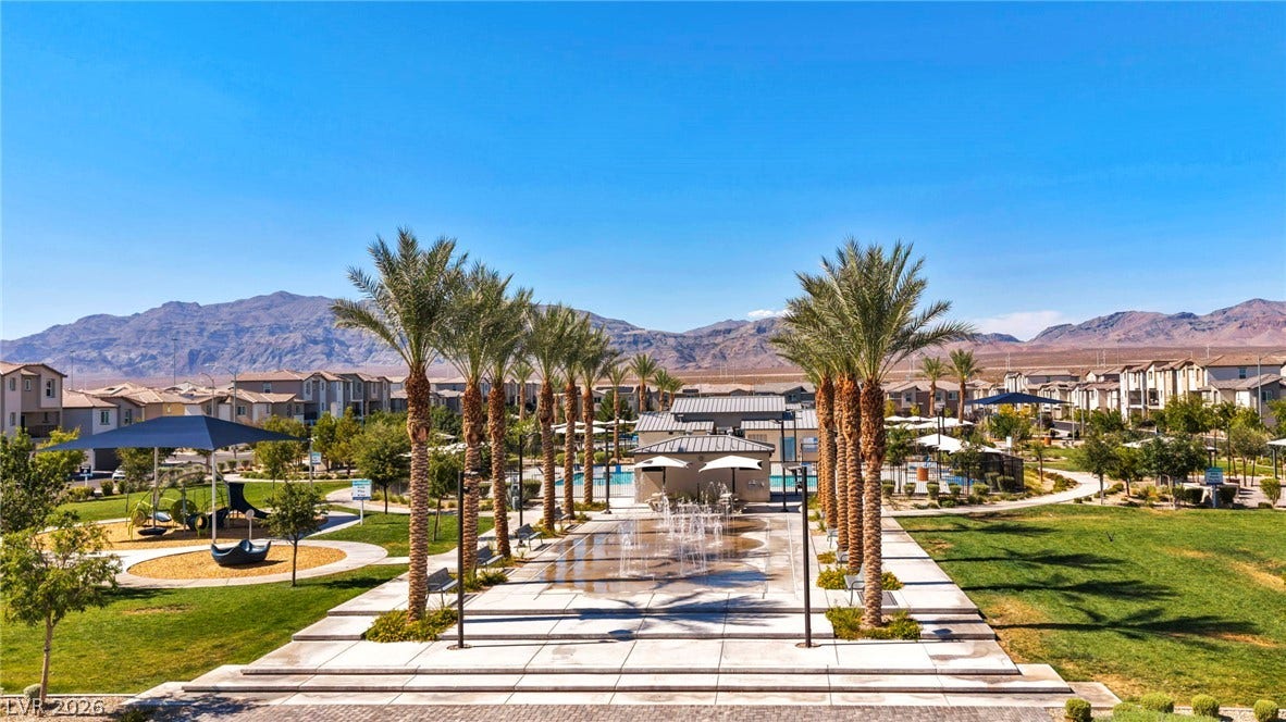 2594 Canary Yellow Court, North Las Vegas, NV 89086 Palm trees frame a sprawling community park set against a mountain backdrop.
