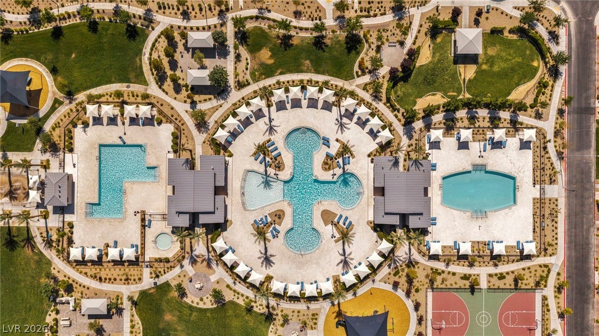 2594 Canary Yellow Court, North Las Vegas, NV 89086 An aerial perspective reveals a beautifully planned recreation complex with multiple pools and sports courts.
