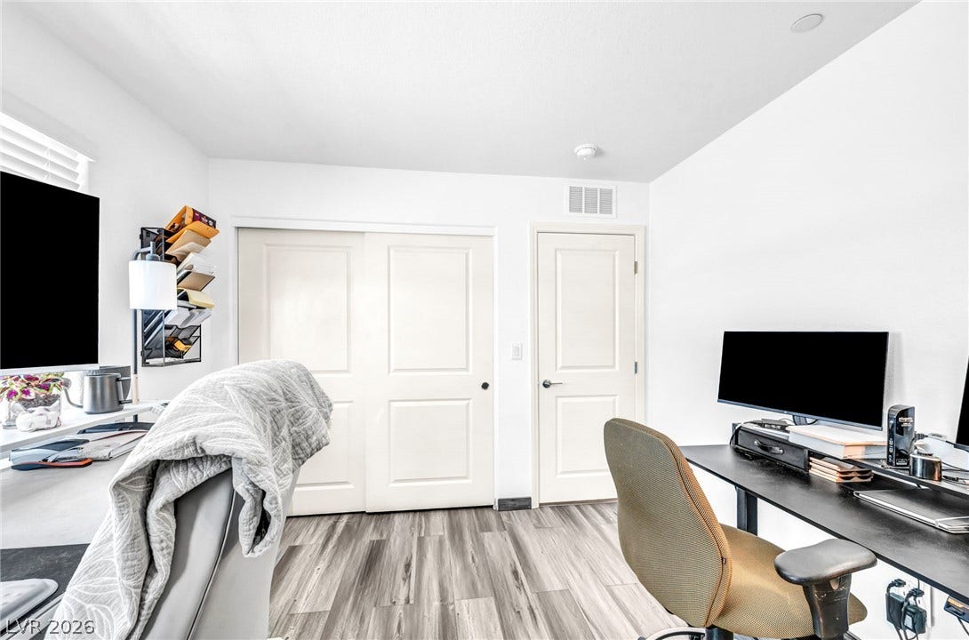 2594 Canary Yellow Court, North Las Vegas, NV 89086 Gleaming modern floors anchor this versatile room illuminated by recessed lighting.