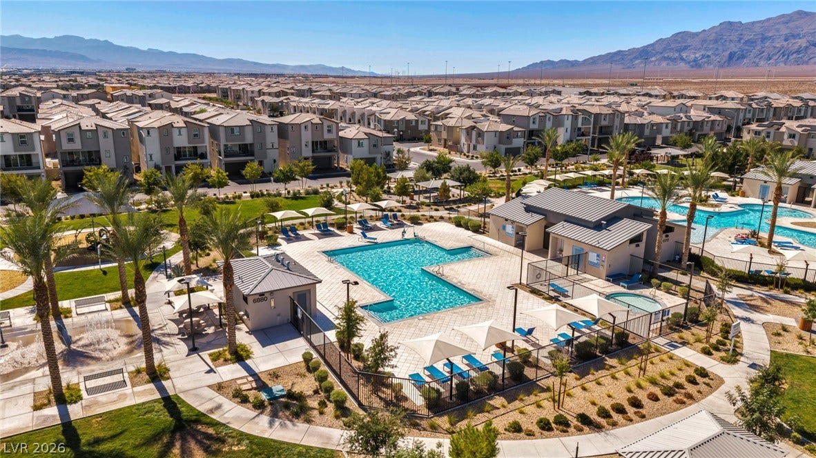 2594 Canary Yellow Court, North Las Vegas, NV 89086 A community swimming pool rests before sweeping desert mountain vistas.