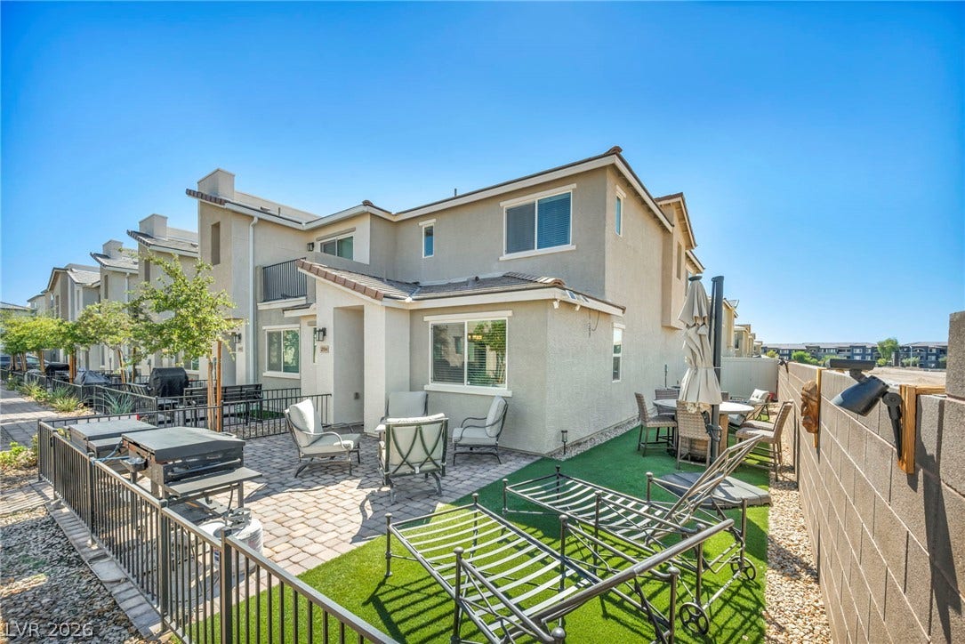 2594 Canary Yellow Court, North Las Vegas, NV 89086 An inviting paved patio area offers low-maintenance outdoor living spaces bordered by block wall fencing.