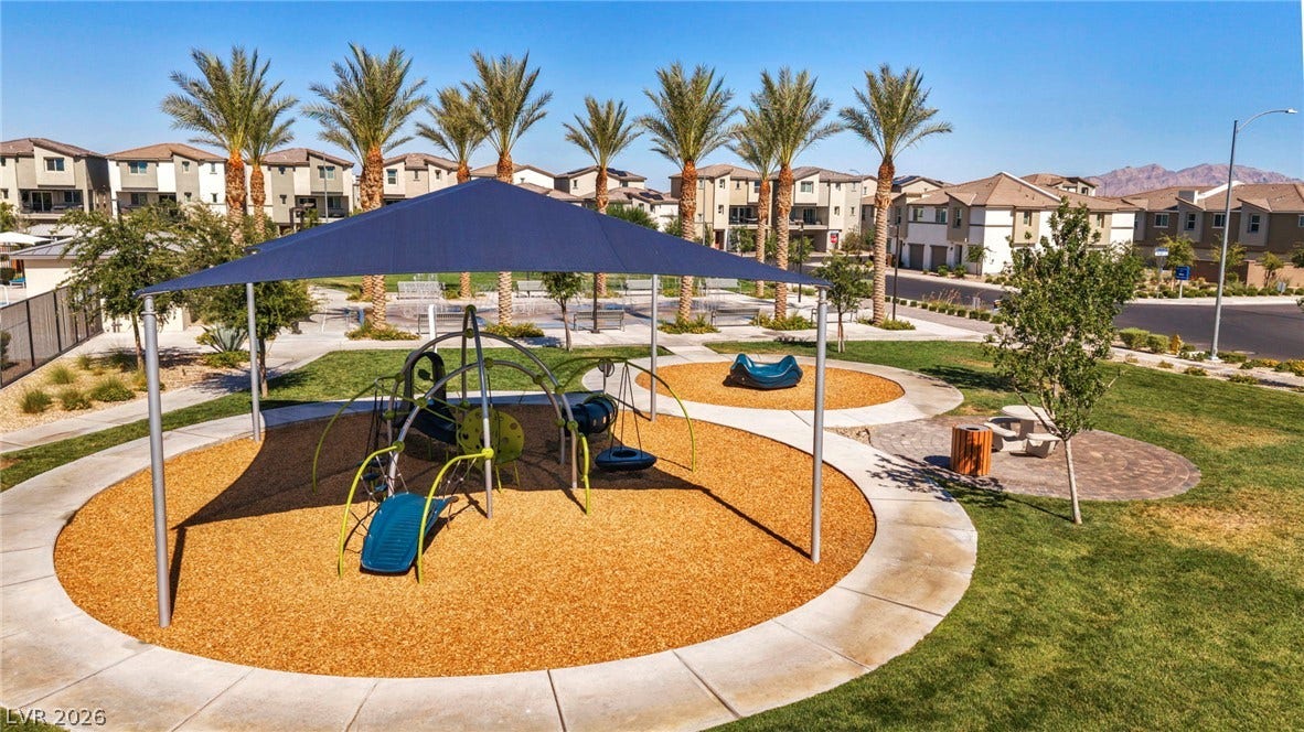 2594 Canary Yellow Court, North Las Vegas, NV 89086 A shaded playground structure sits within a landscaped park surrounded by neighborhood residences.