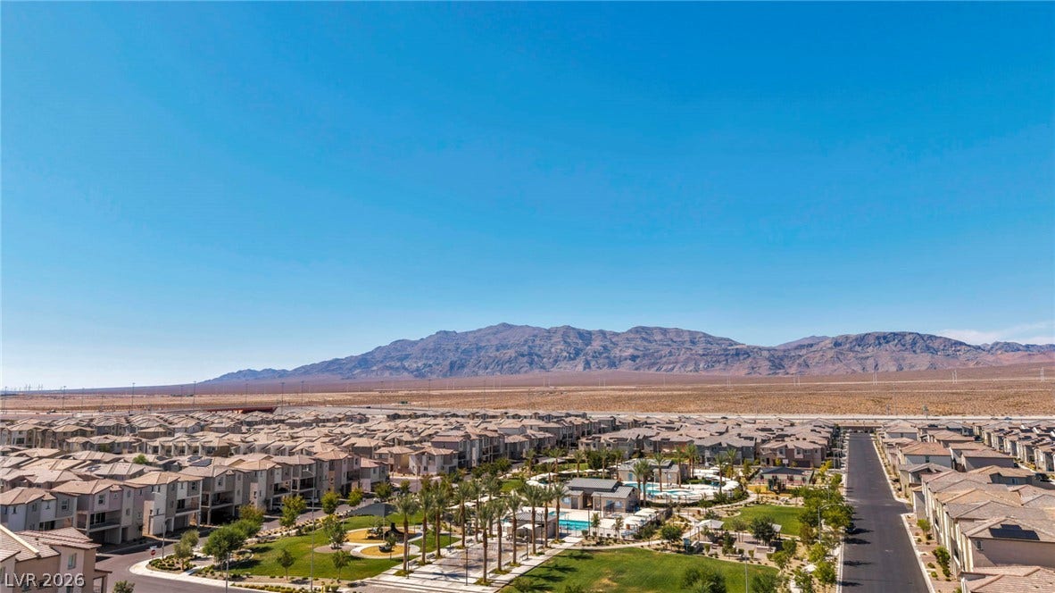 2594 Canary Yellow Court, North Las Vegas, NV 89086 Expansive desert vistas meet community greenspaces and neighborhood pool facilities under clear skies.