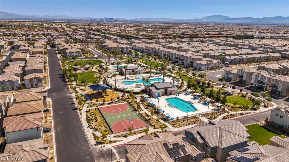 2594 Canary Yellow Court, North Las Vegas, NV 89086 A vibrant neighborhood community center featuring multiple swimming pools and a full basketball court.