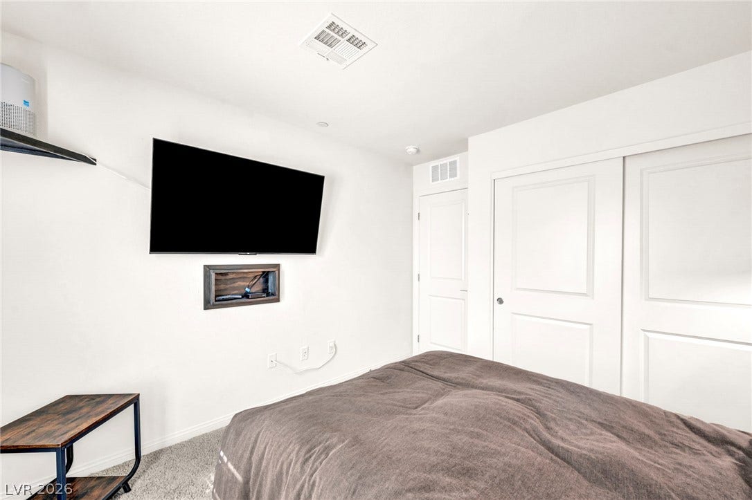 2594 Canary Yellow Court, North Las Vegas, NV 89086 Bright walls and soft carpeting define this comfortable secondary bedroom.