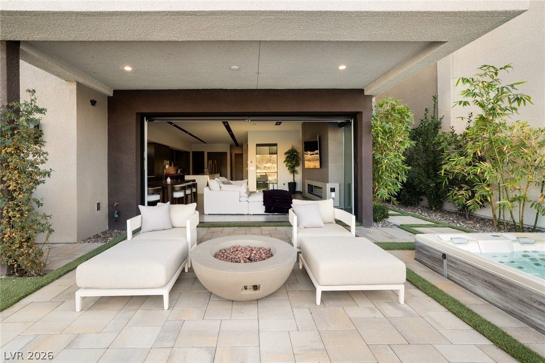 34 Lakefront Drive, Henderson, NV 89011 Seamless transitions connect indoor living areas directly to a private paved patio with integrated spa.