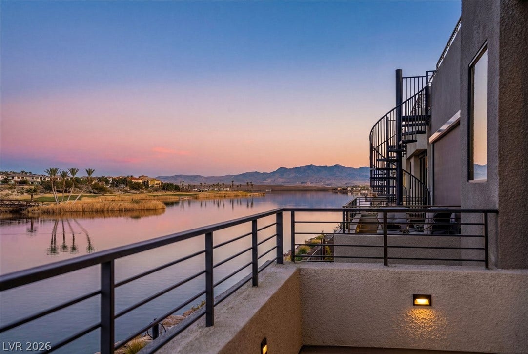 34 Lakefront Drive, Henderson, NV 89011 Serene waterfront vistas unfold from this modern balcony with a spiral staircase.