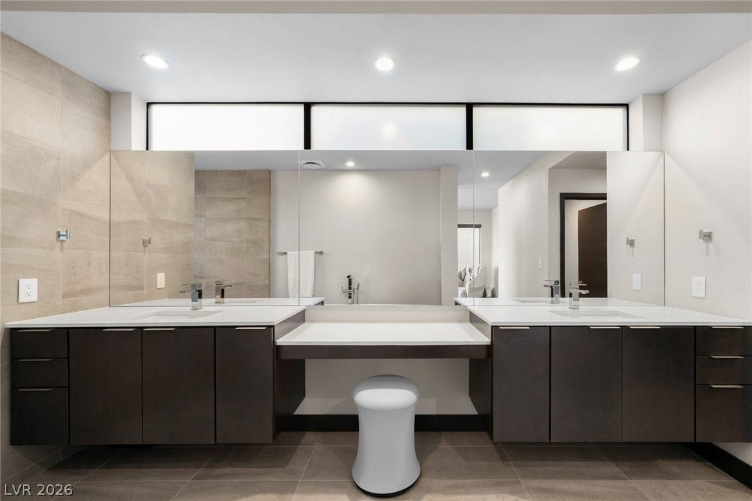 34 Lakefront Drive, Henderson, NV 89011 Clean lines and a spacious dual vanity define this modern bathroom design.