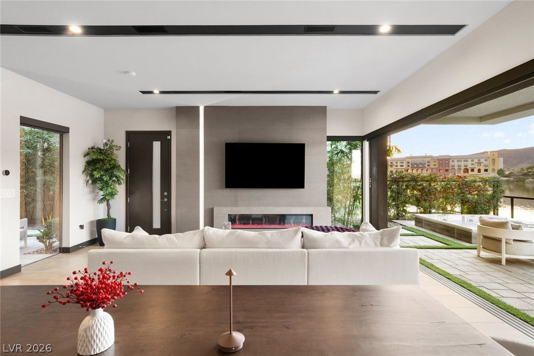 34 Lakefront Drive, Henderson, NV 89011 Modern sliding glass doors seamlessly connect this open living space to the scenic patio.