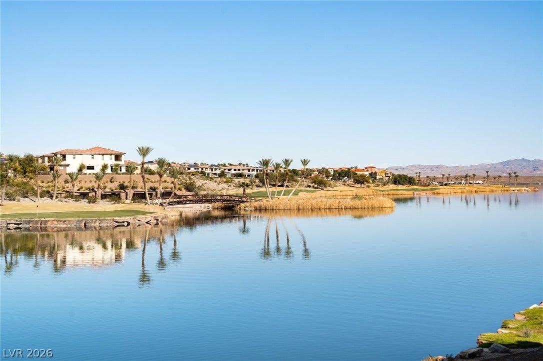 34 Lakefront Drive, Henderson, NV 89011 Serene water views extend across the lake toward the manicured fairways and distant mountains.