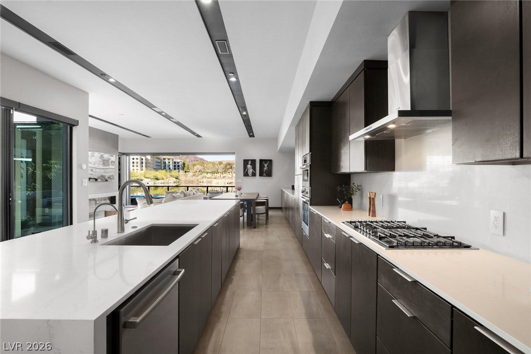 34 Lakefront Drive, Henderson, NV 89011 High-end finishes and clean lines define this contemporary kitchen overlooking the scenic outdoor landscape.