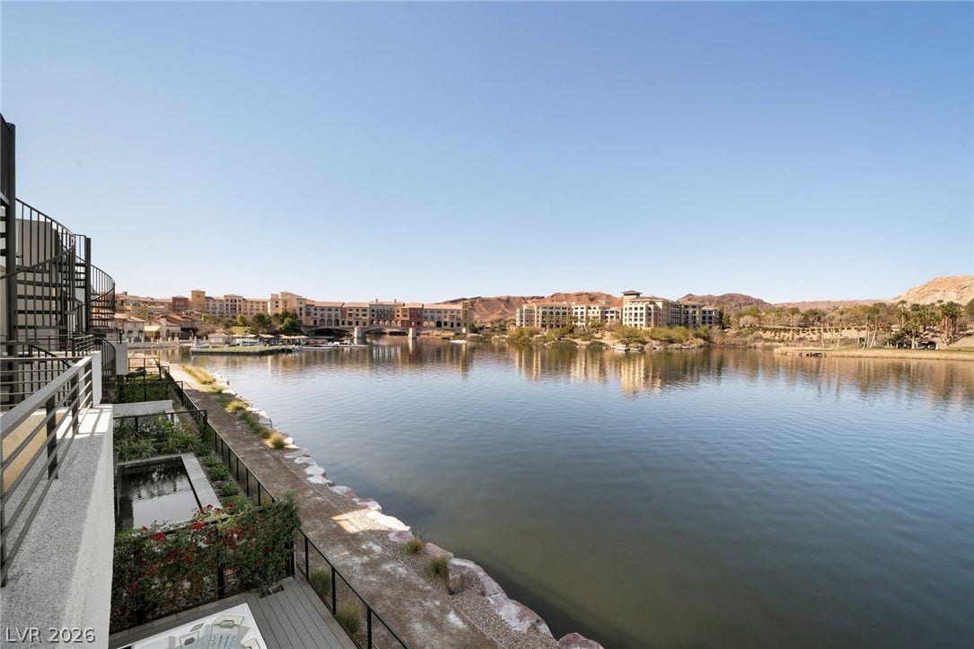 34 Lakefront Drive, Henderson, NV 89011 Serene waterfront panoramas stretch across the calm lake from the private outdoor balcony.