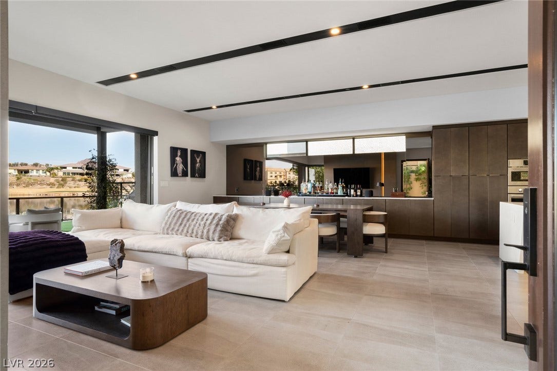 34 Lakefront Drive, Henderson, NV 89011 Clean lines and tiled floors define this modern open living space bordering the water.