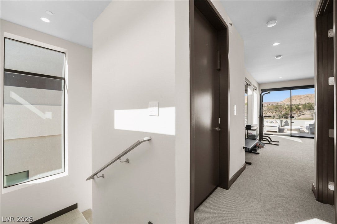 34 Lakefront Drive, Henderson, NV 89011 Gleaming recessed lighting and clean architectural lines define this upper level landing.