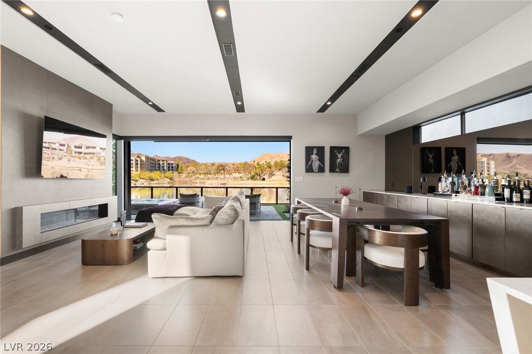 34 Lakefront Drive, Henderson, NV 89011 Retractable glass doors seamlessly connect this modern living area to the waterfront deck.