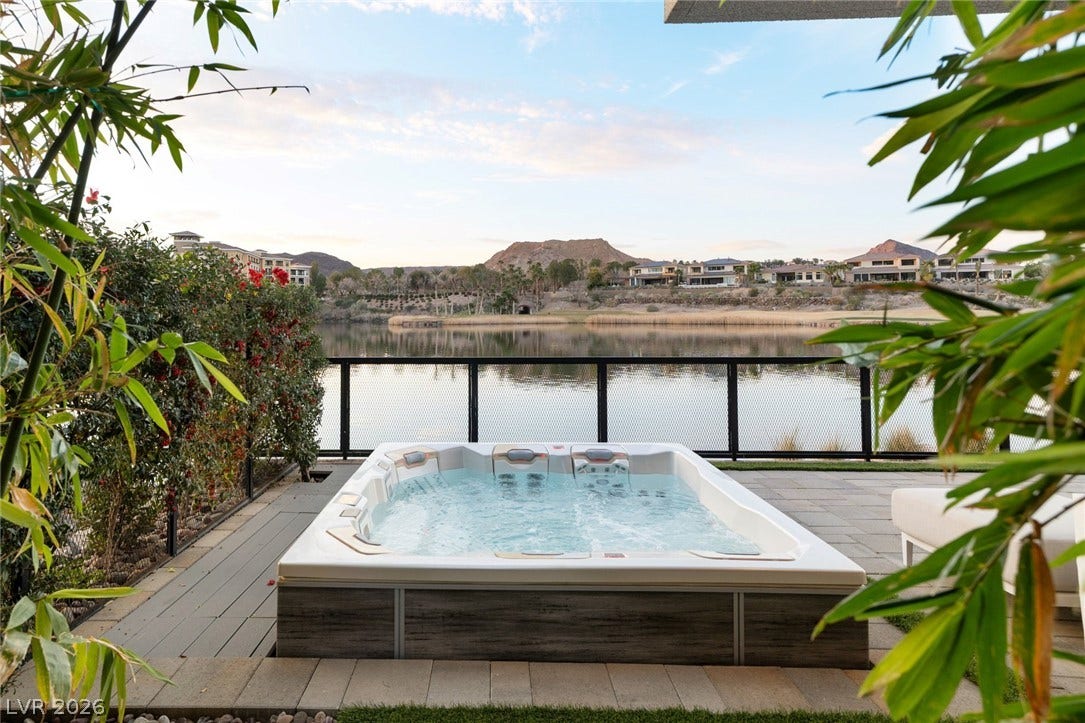 34 Lakefront Drive, Henderson, NV 89011 A tranquil outdoor spa overlooks the serene waters and distant mountain peaks.