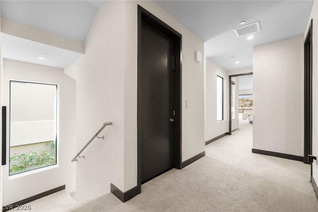 34 Lakefront Drive, Henderson, NV 89011 Clean lines and plush neutral carpeting define this modern, sunlit upper landing area.
