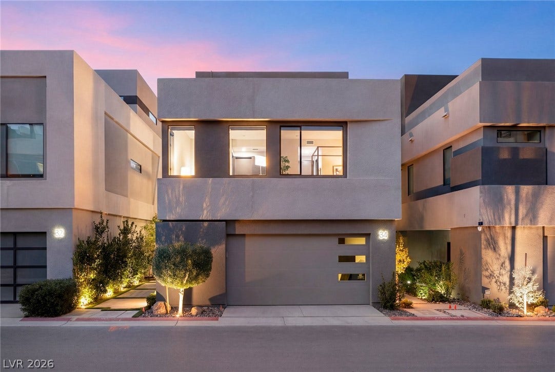 34 Lakefront Drive, Henderson, NV 89011 Clean architectural lines and large windows define this modern multi-level residence at sunset.