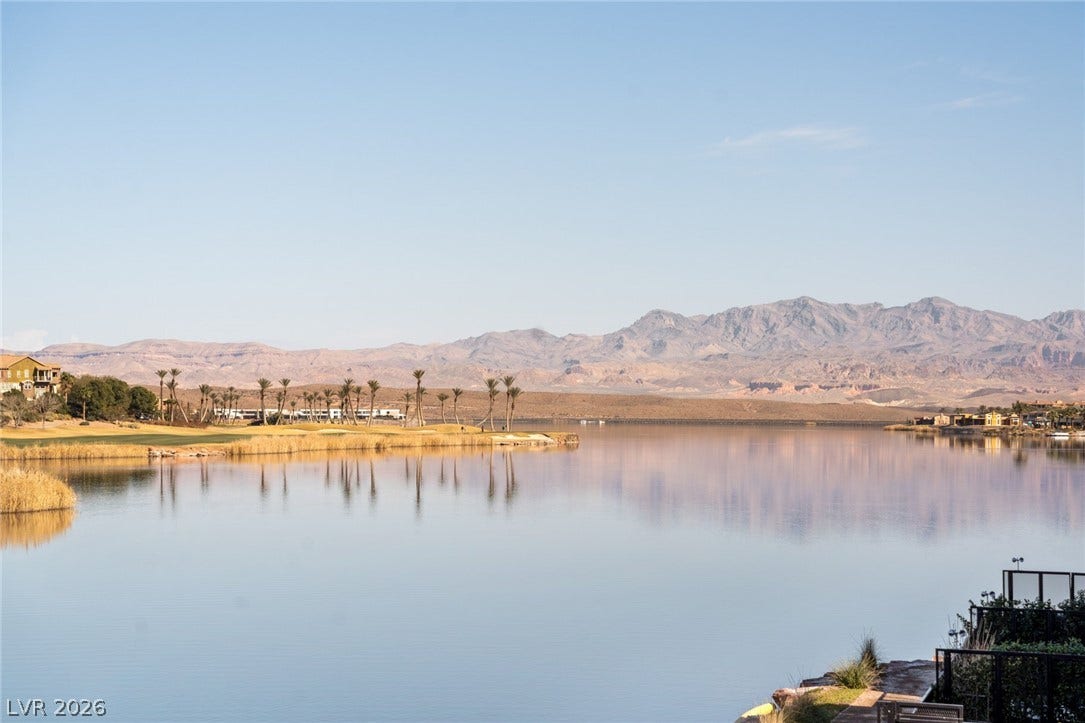 34 Lakefront Drive, Henderson, NV 89011 Sweeping mountain and water views provide a serene backdrop from this lakeside vantage point.