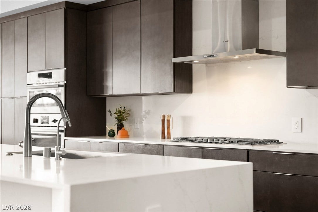 34 Lakefront Drive, Henderson, NV 89011 Sleek contemporary cabinetry pairs with stone countertops and premium built-in appliances.