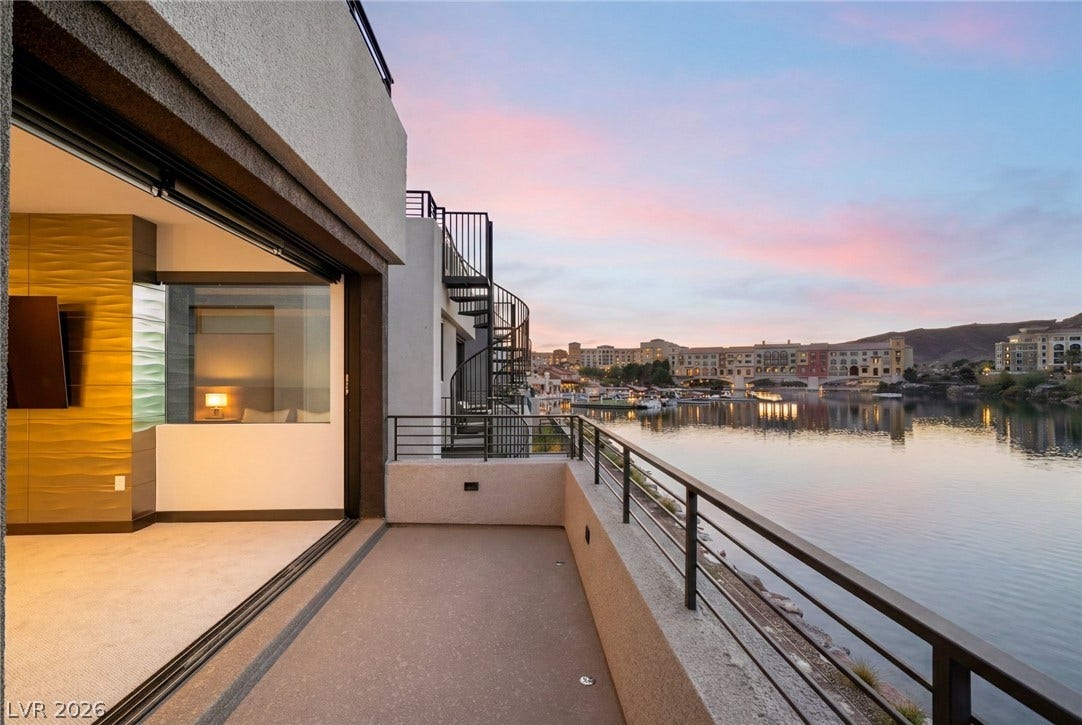 34 Lakefront Drive, Henderson, NV 89011 Sliding glass doors connect the interior to a private balcony overlooking the calm water.