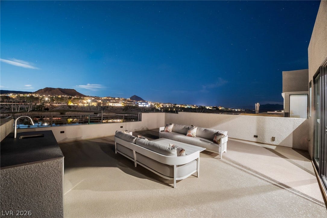 34 Lakefront Drive, Henderson, NV 89011 A spacious rooftop terrace provides sweeping night views of the surrounding hills and city lights.