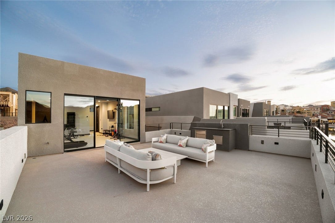 34 Lakefront Drive, Henderson, NV 89011 An expansive rooftop terrace offers ample outdoor living space against a mountain backdrop.