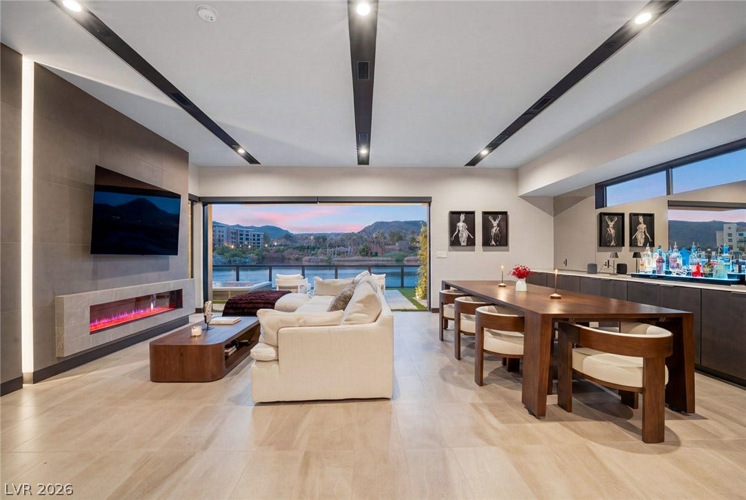 34 Lakefront Drive, Henderson, NV 89011 Sliding glass doors merge this modern great room with a scenic lakeside terrace.