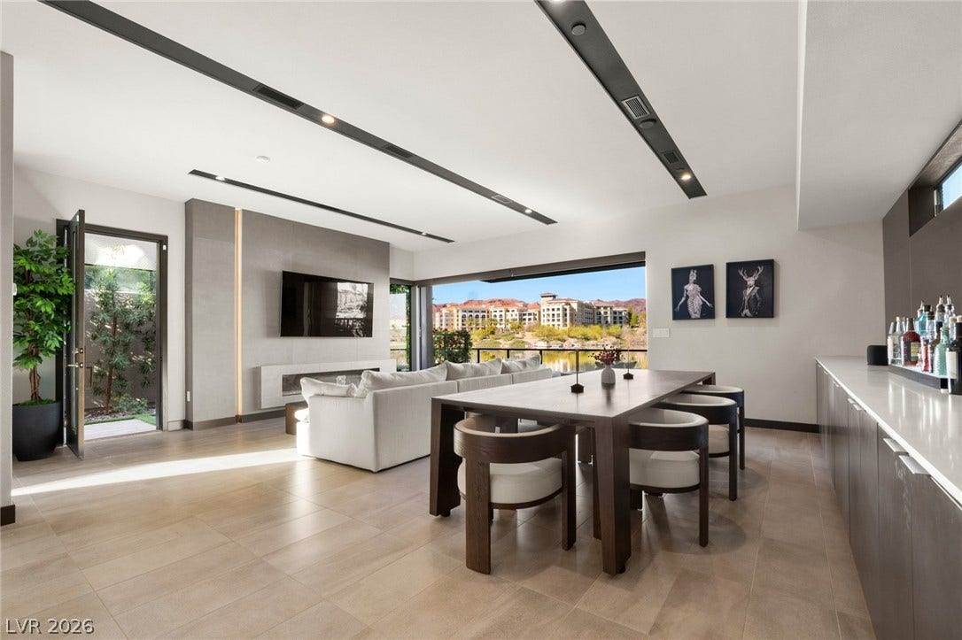 34 Lakefront Drive, Henderson, NV 89011 An open-concept living and dining area connects seamlessly to the outdoors through sliding doors.