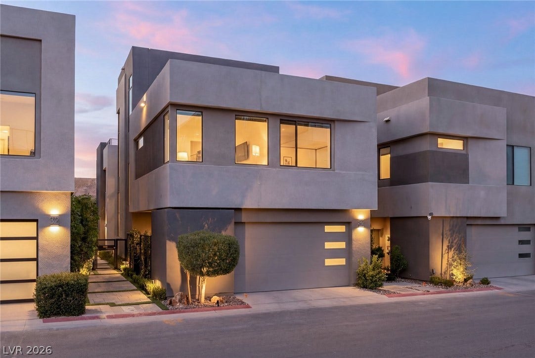 34 Lakefront Drive, Henderson, NV 89011 Bold geometric lines and smooth stucco define this contemporary multi-level exterior under a twilight sky.