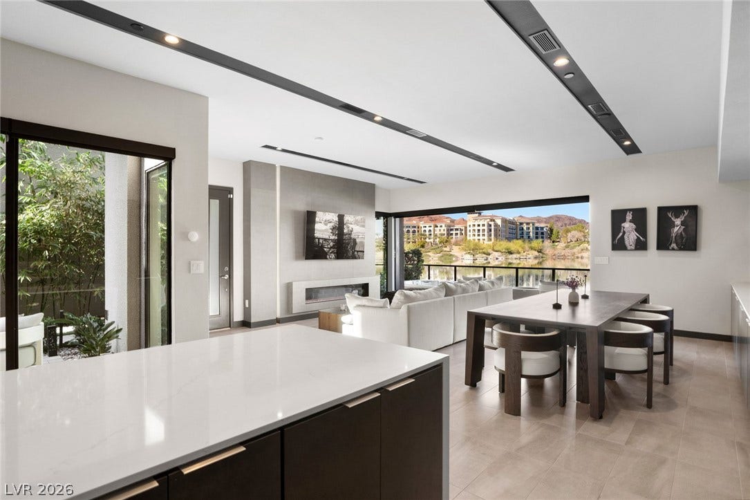 34 Lakefront Drive, Henderson, NV 89011 An open-concept living area flows into the dining space, framed by sliding glass doors.