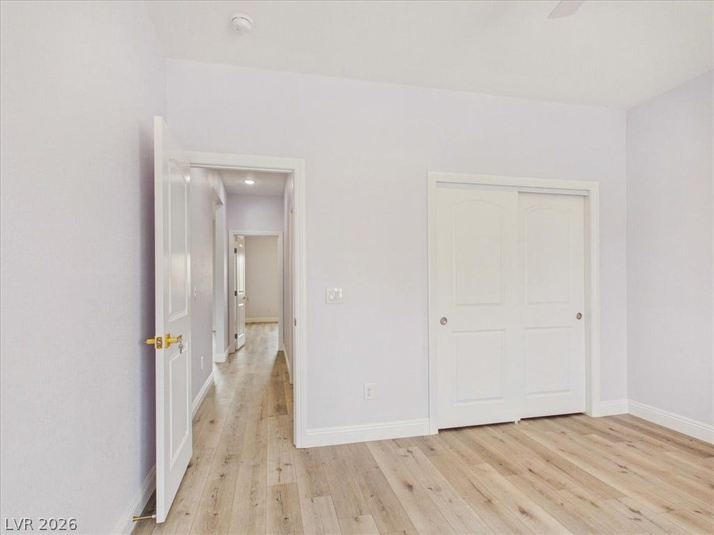 6680 S Raintree Court, Pahrump, NV 89061 Gleaming hardwood floors and a spacious sliding closet define this versatile secondary bedroom.