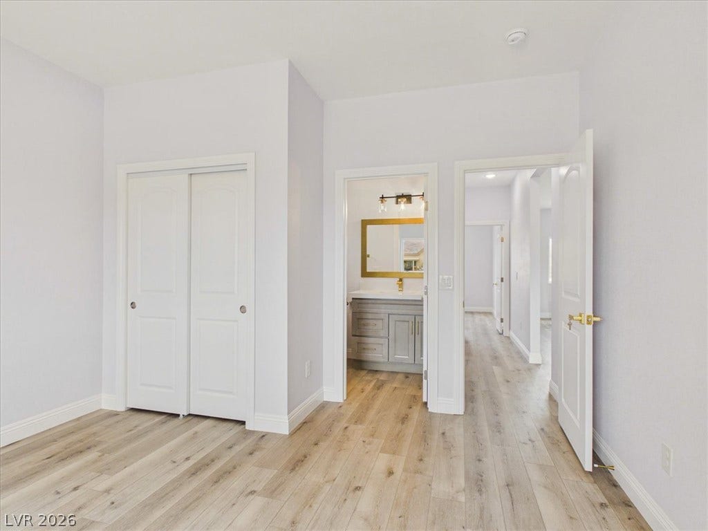 6680 S Raintree Court, Pahrump, NV 89061 Smooth wood floors flow effortlessly from this versatile room into the adjacent bathroom and hallway.
