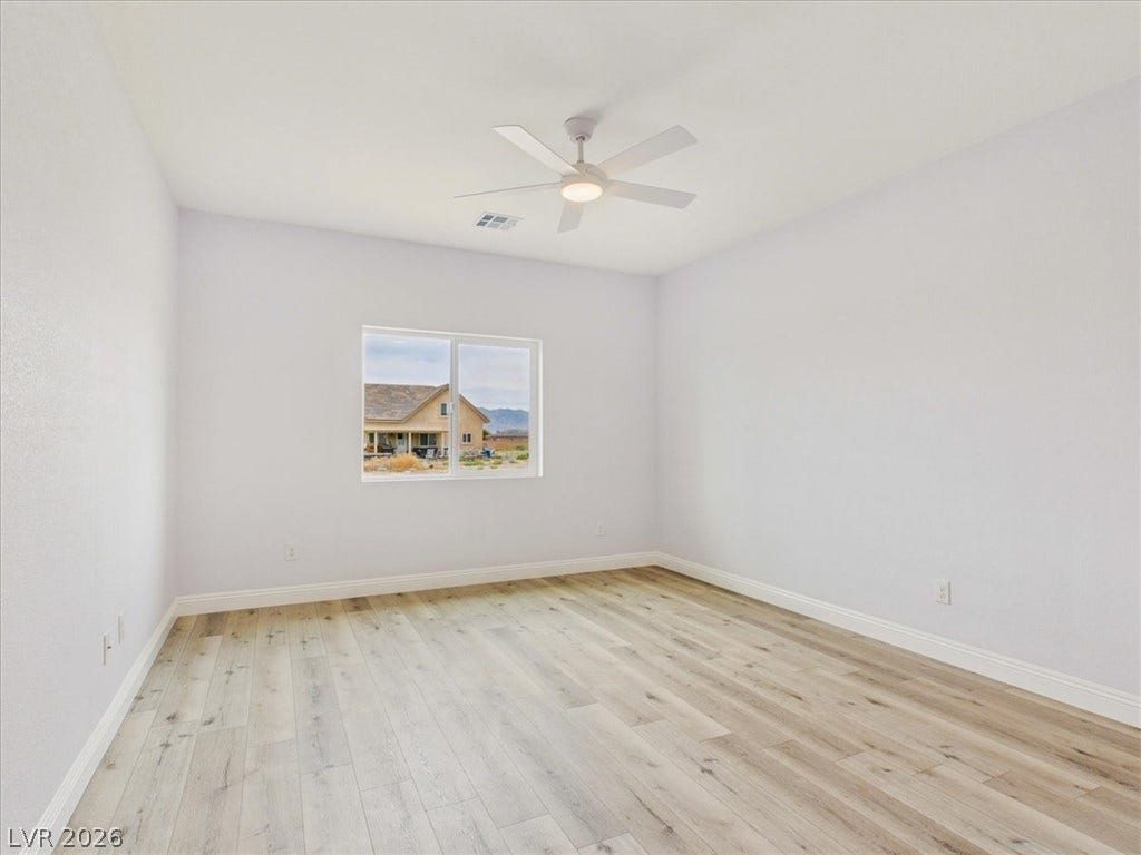 6680 S Raintree Court, Pahrump, NV 89061 Smooth wood-look flooring and clean lines define this versatile secondary space.
