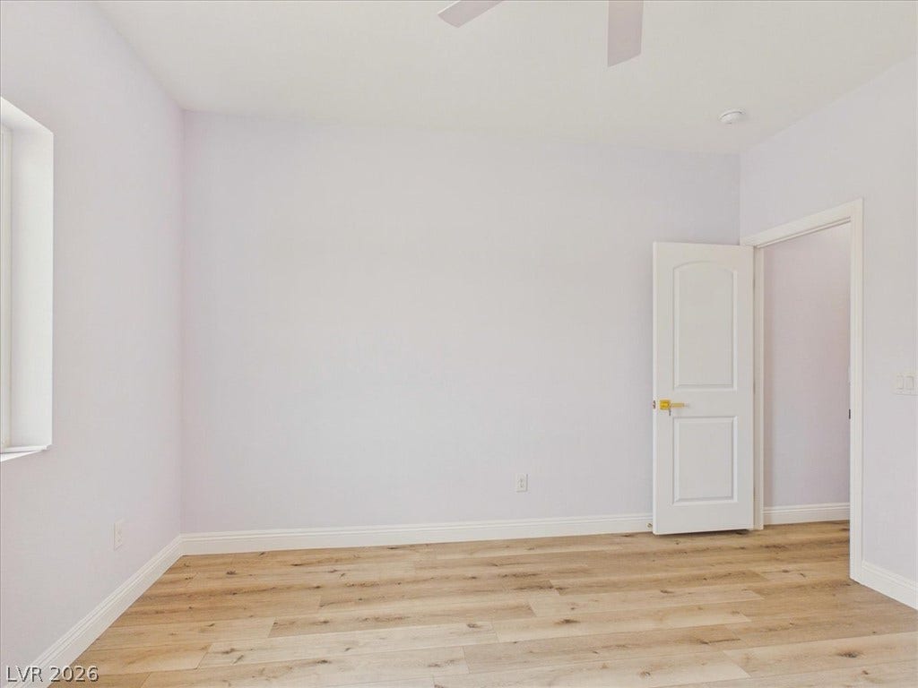 6680 S Raintree Court, Pahrump, NV 89061 Smooth wood floors and crisp baseboards anchor this versatile light-filled space.