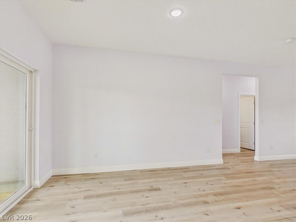6680 S Raintree Court, Pahrump, NV 89061 Clean lines and smooth plank flooring define this versatile, light-filled living space.